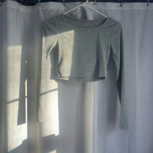 Gray long sleeve top. Scoop neck. Slightly cropped